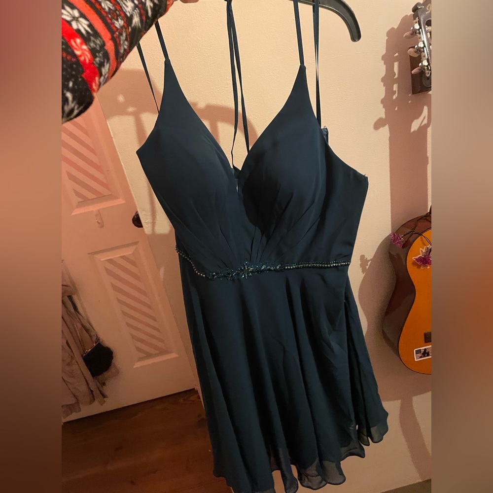EROS emerald green dress
Never worn
Willing to trade for a dress size 0 or 00